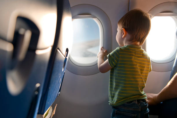 Child travelling by plane stock photo