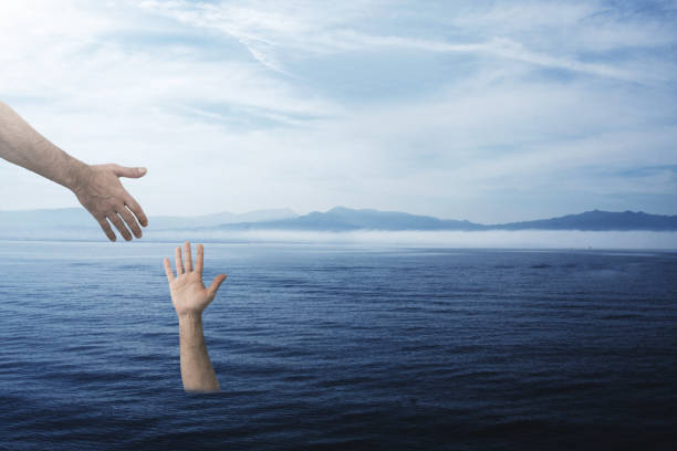 istock hand asking for help at sea, rescue and salvage 1159811455