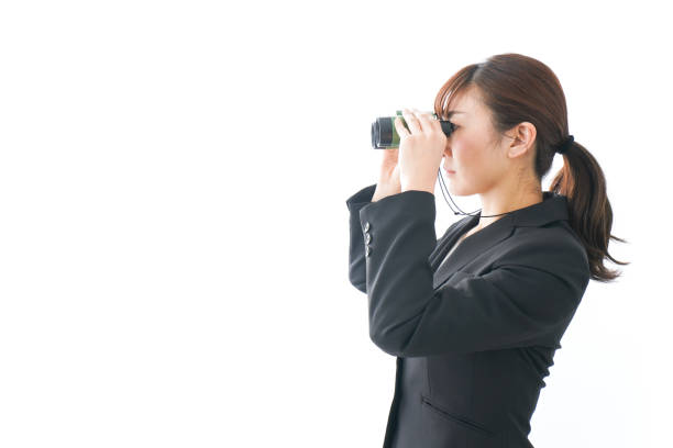 istock Young business woman looking closer 1159811785