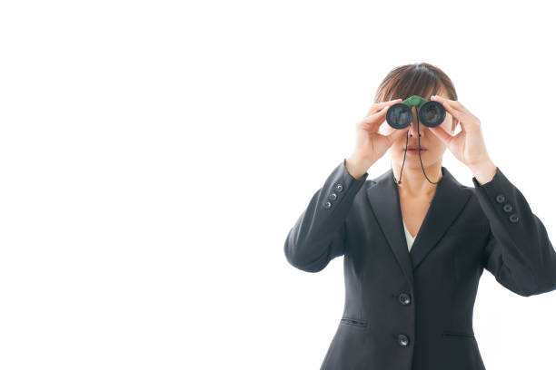 istock Young business woman looking closer 1159811790