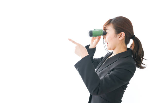 istock Young business woman looking closer 1159811799