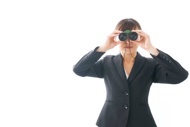 istock Young business woman looking closer 1159811802