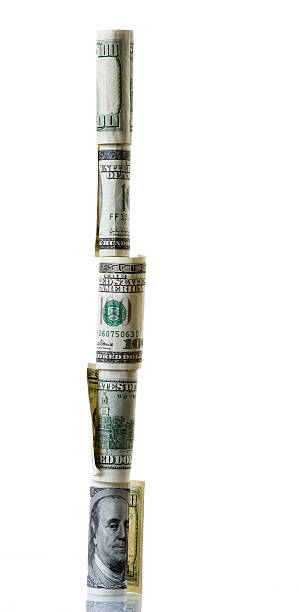 Financial pyramid - scam. Tower from US dollars banknotes dollar's tower, or financyal pyramid - scam. Piramid from US dollars banknotes isolated on white. tower of babel stock pictures, royalty-free photos & images