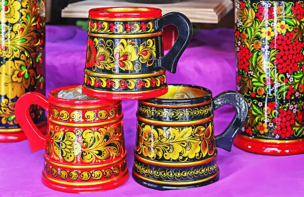 Khokhloma - Old Russian folk painting on wood. Wooden dishes with the national Russian ornament - Khokhloma.