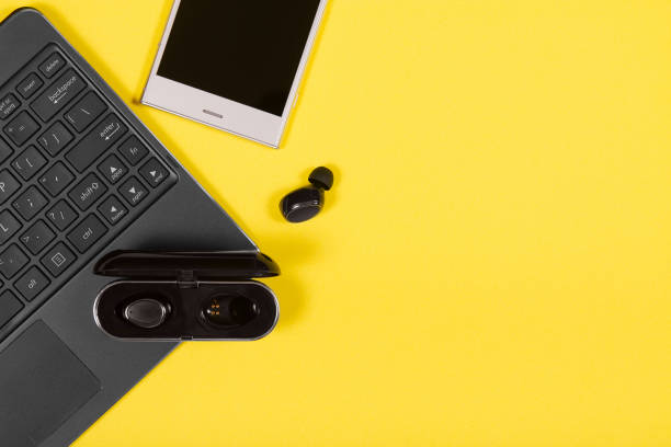 istock Laptop, smartphone, charging case and wireless earpieces 1159813786