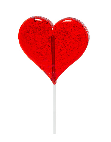 Colourful lollipop in the shape of a heart isolated on white background