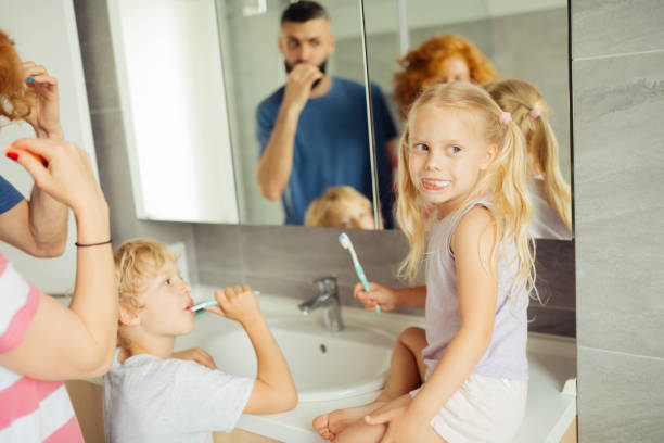 istock Nice blonde girl sitting on the sink 1159816666