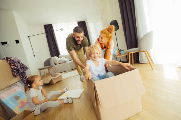 istock Nice blonde boy sitting in the box 1159816744