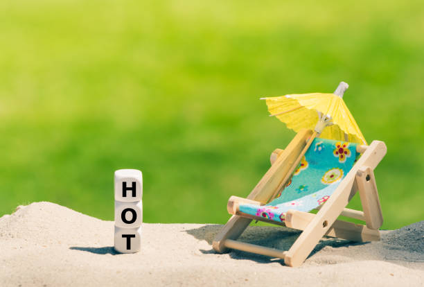 Dice placed next to a beach chair form the word 