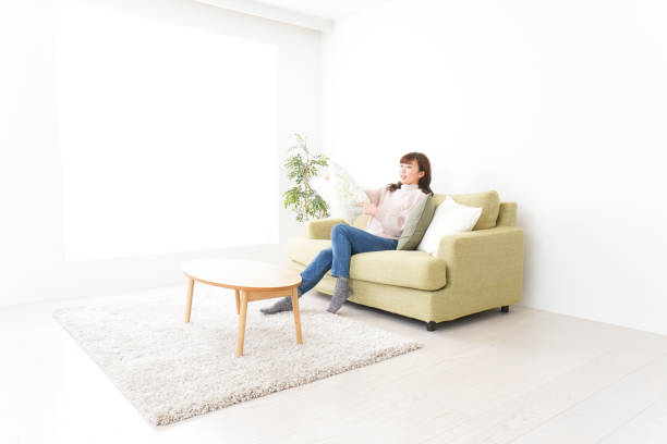 istock Young woman relaxing at home 1159817226