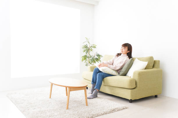 istock Young woman relaxing at home 1159817235
