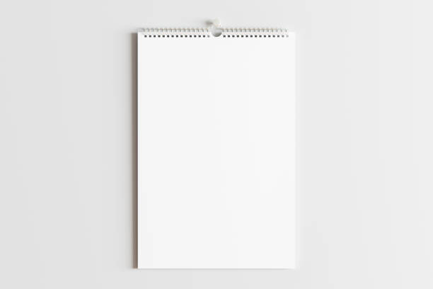 Blank calendar mock up on the wall. Blank vertical calendar mock up on the white wall. 3d illustration wall calendar stock pictures, royalty-free photos & images
