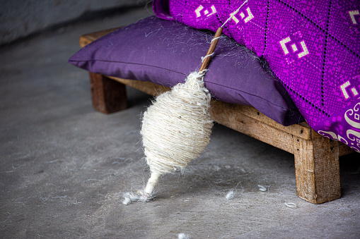 Primitive domestic methods of yarn spinning