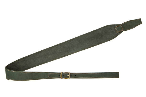istock Green leather shoulder strap for a gun isolated on white background 1159826437