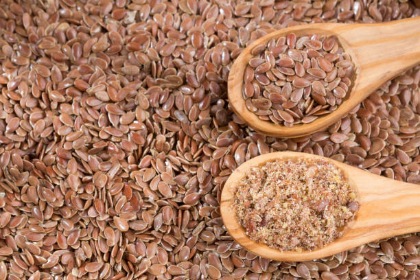 istock whole and crushed flax seeds - Linum usitatissimum 1159829701