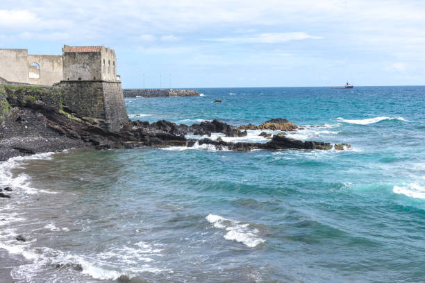 istock Coast rocks in azores. Waves splashing on basalt rocks 1159831177