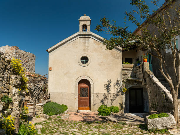 istock small chapel standing next to an orange house 1159831478