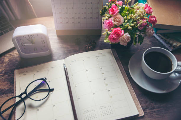 istock Planner and Concept.Desktop Calender 2019,cup of coffee place on office desk,working space.Notebook for Planner to make timetable agenda,appointment and agenda each date,month and year 1159838676