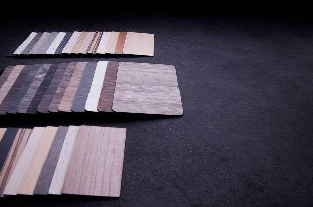 istock Construction Design. Interior Material Design concept. Wood texture floor Samples of laminate and vinyl floor tile. 1159840073