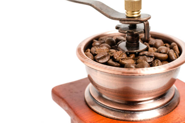 istock Retro wooden coffee grinder on white background with coffee beans. 1159840691