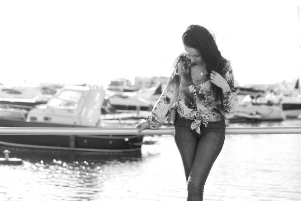 Portrait of a young woman in Faro harbor, Portugal.