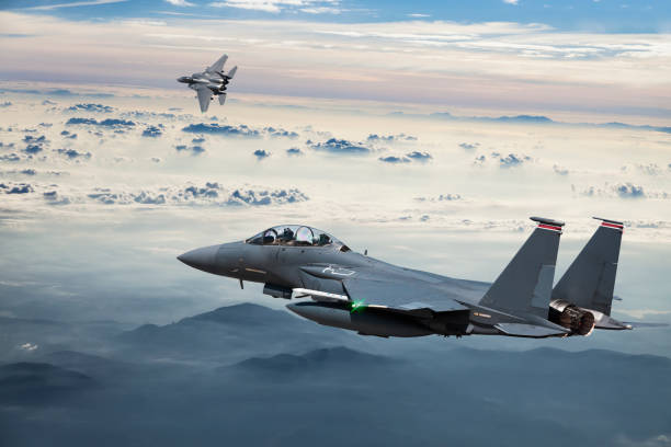 istock F-15 Eagle Fighter Jets in Flight with afterburner above the fogy mountains 1159843712
