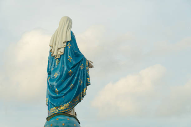 istock Our lady, The blessed Virgin Mary on blue sky background. 1159844355