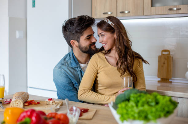 istock Lovely couple in the kitchen 1159845850