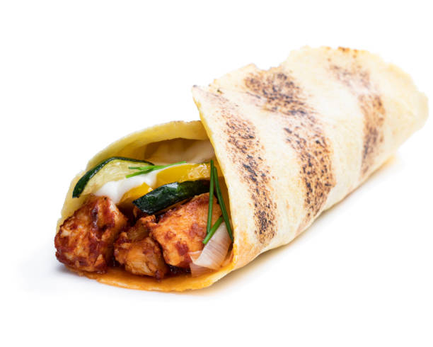 Homemade grilled chicken burrito with vegetables and tortilla isolated on white Homemade  grilled chicken burrito with vegetables and tortilla isolated on white pita bread isolated stock pictures, royalty-free photos & images