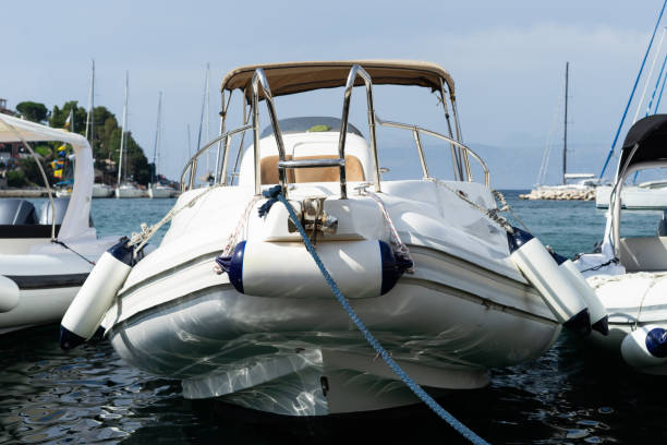 istock Low angle view on the boat in the harbor dock tied in summer day 1159848758