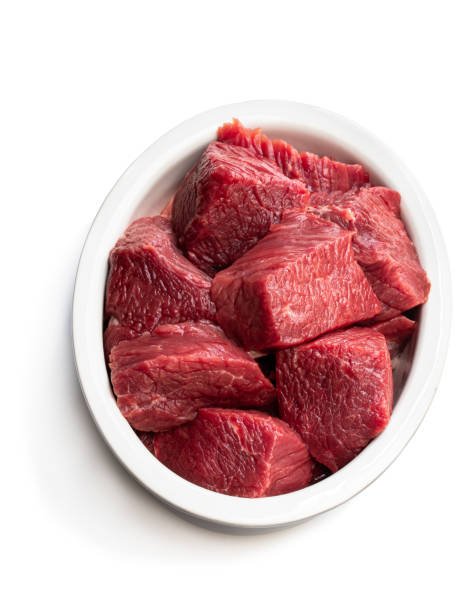 istock Sliced raw beef in ceramic bowl isolated on white 1159848785