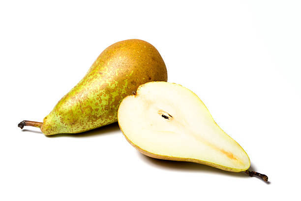 whole and half pear isolated on white whole and half pear isolated on white background conference pear stock pictures, royalty-free photos & images