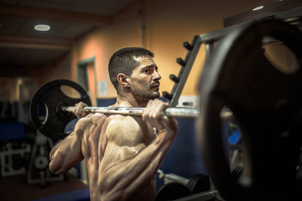 istock Muscular man working out in gym, strong male torso 1159851202