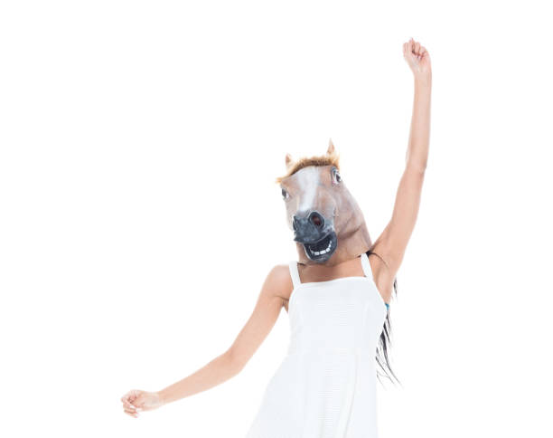 istock Cute female wearing a horse head 1159852663