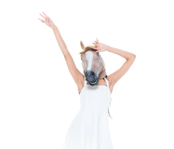istock Cute female wearing a horse head 1159852666