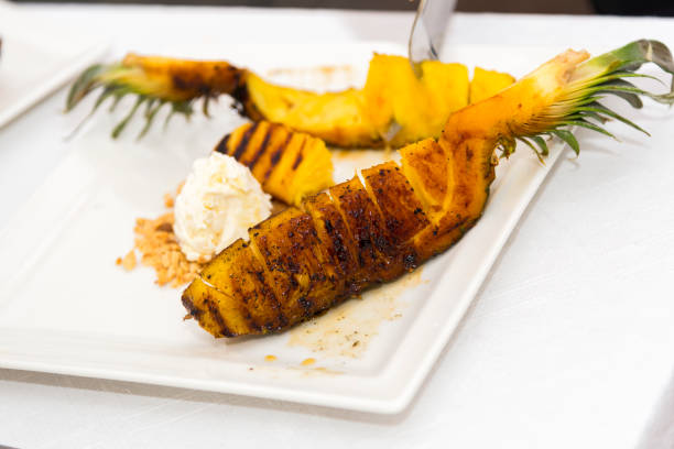 Grilled pineapple with vanilla ice cream. Grilled pineapple with vanilla ice cream. blade roast stock pictures, royalty-free photos & images
