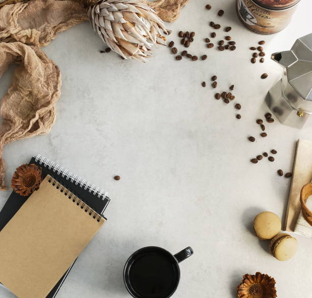 istock Autumn composition. Cup of coffee, macaroons , dried flowers, notebook on grey background.  Flat lay, top view, copy space 1159855646