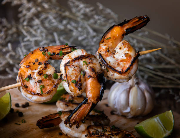 istock Skewer shrimps burnt grilled with spice seasoning. 1159858030