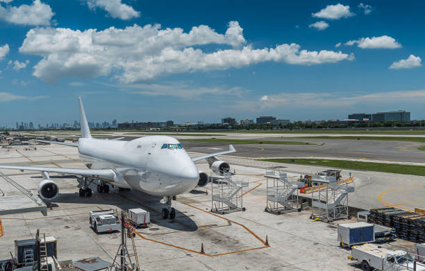 Miami Cargo Blank cargo plane beside the runway of the Miami airport. upward mobility stock pictures, royalty-free photos & images