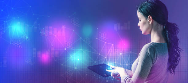 istock Digital graphs and hexagon grids with woman using a tablet 1159859707