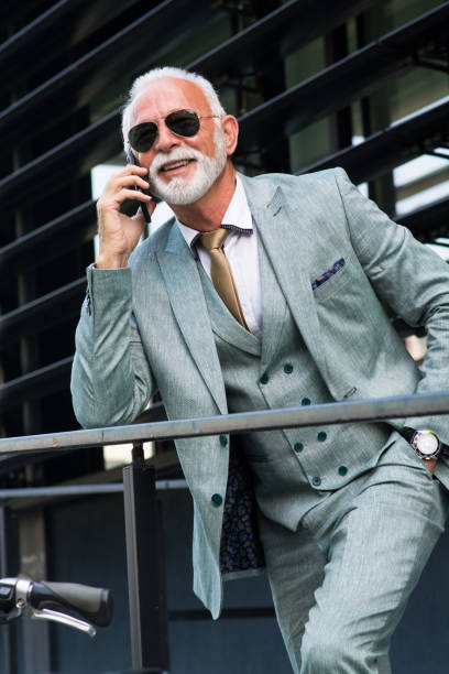 istock Senior businessman using smart phone 1159864059