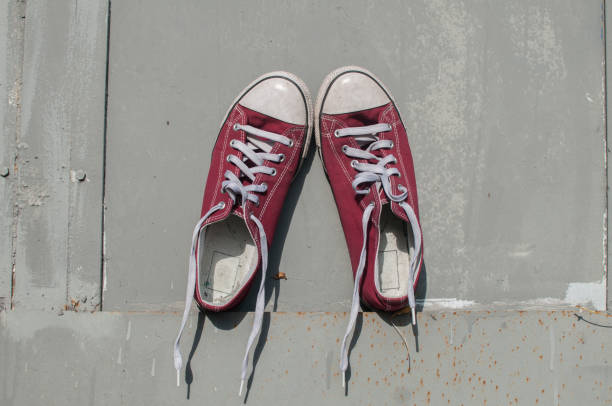 istock Pair of worn sneakers 1159865059