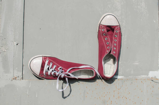 istock Pair of worn sneakers 1159865110
