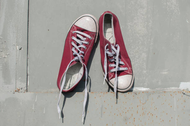 istock Pair of worn sneakers 1159865111