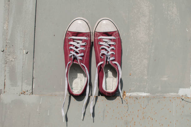 istock Pair of worn sneakers 1159865114