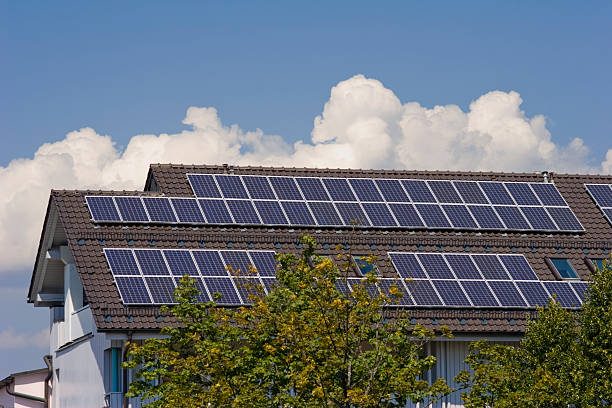 istock House with solar panels on the roof 115986512