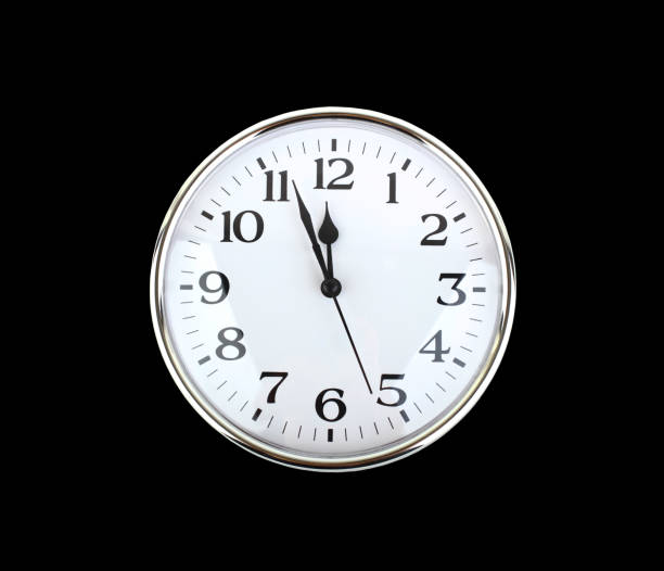 istock Isolated shot of 12 O'Clock clock face on black background 1159865281