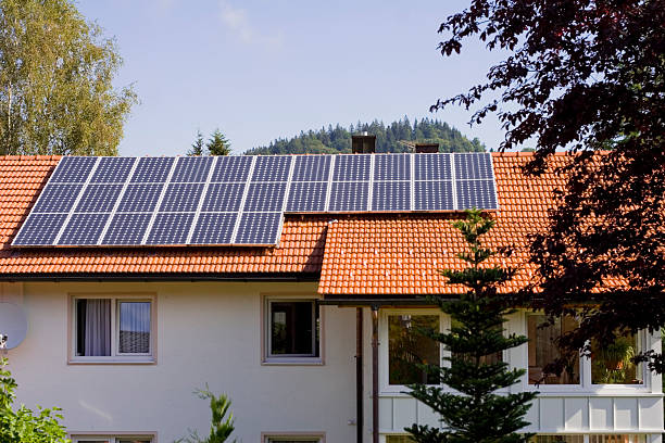 istock House with solar panels on the roof 115986532