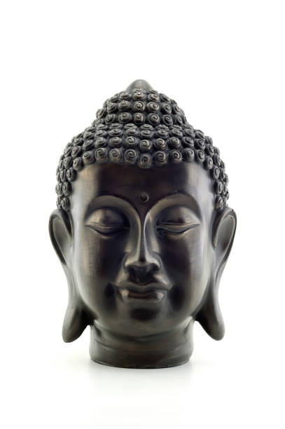 istock Portrait of a Buddha statue isolated on white background 1159867466