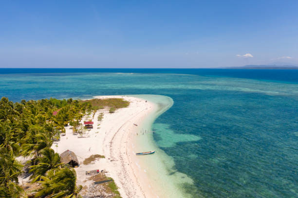 istock Tropical island Canimeran. White sandy beach on a desert island 1159867804
